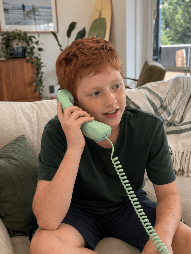 Boy talking on a phone